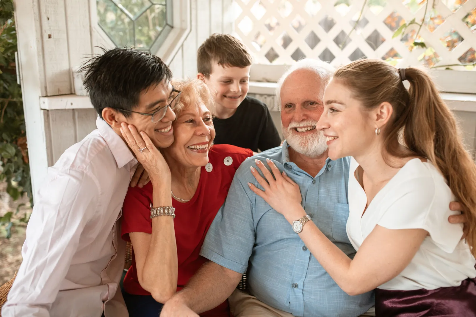 Multiple generations of a family laughing together